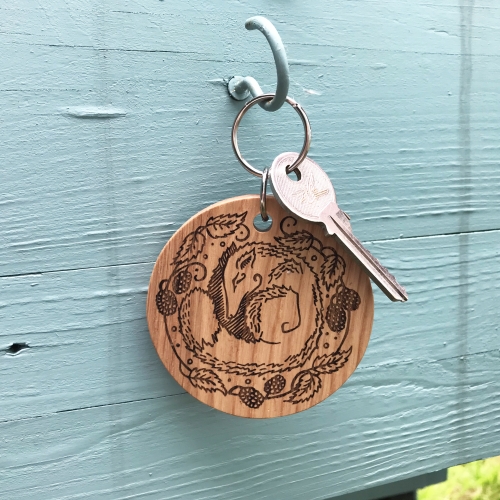 'Sleeping Fox in Bramble Bed' Circular Oak Keyring
